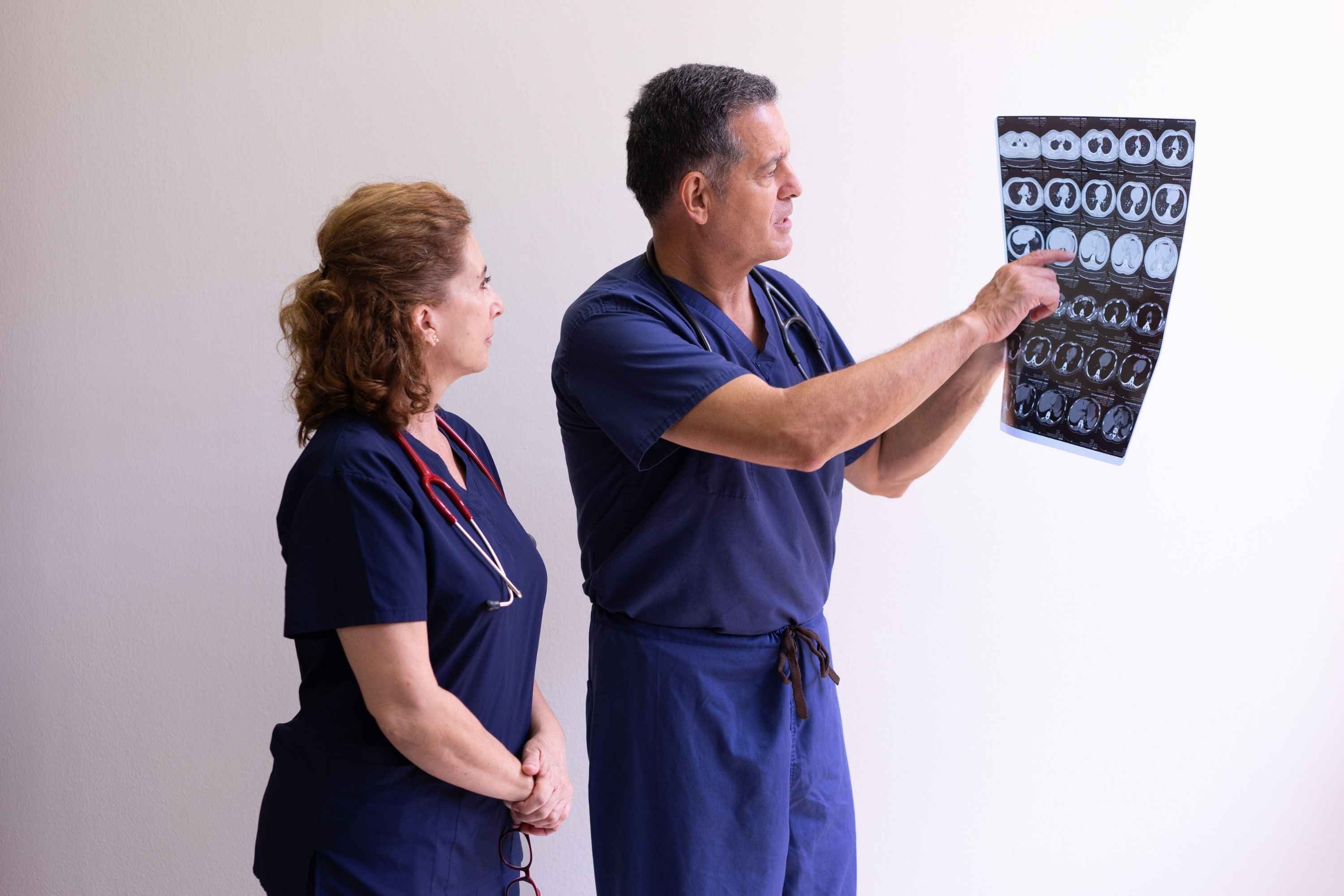 Two healthcare professionals discussing a patient X-ray